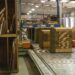 Corrugated Boxes Being Moved Down A Conveyor Belt.