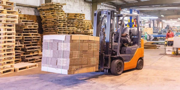 forklift moving corrugated boxes