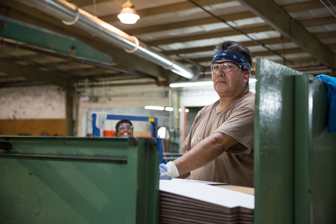 man working in corrugated cardboard factory