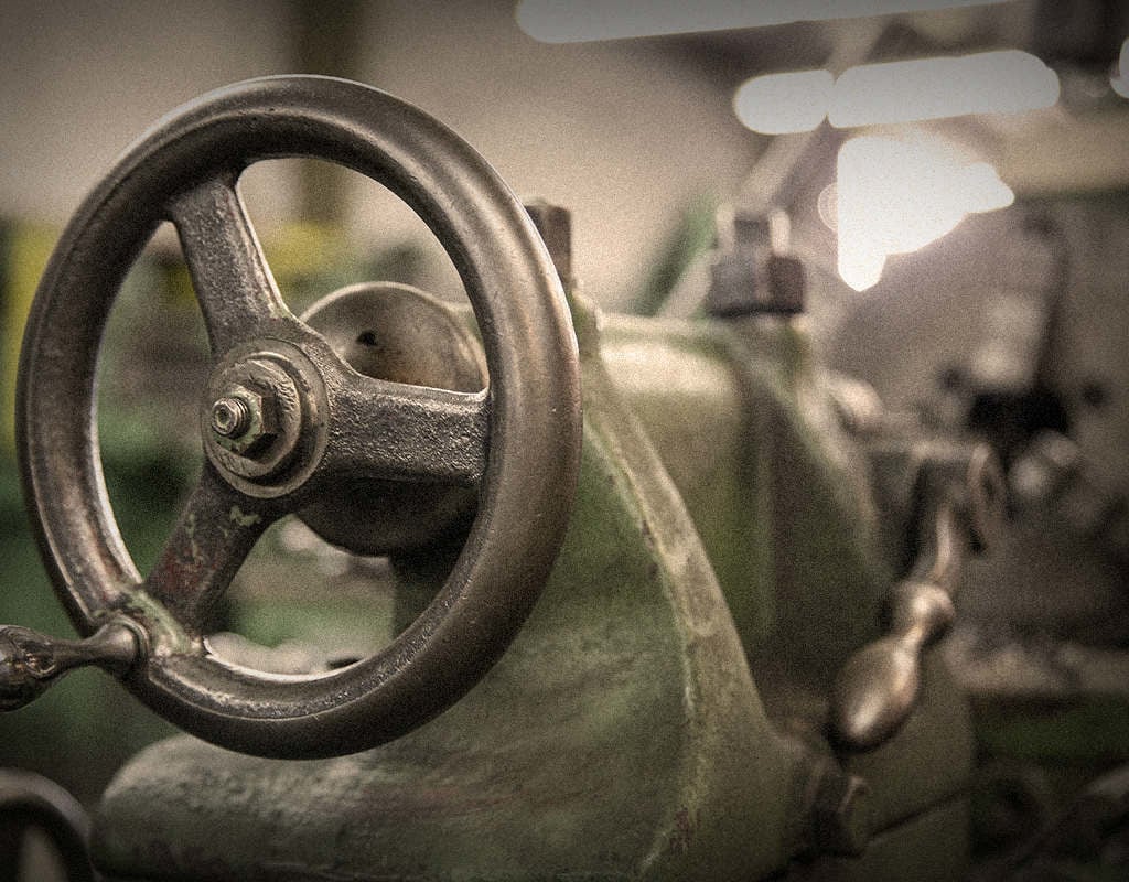 close up of hand crank on old tool